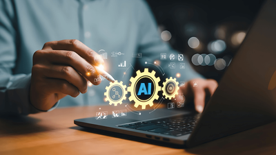 Business analyst using a laptop with AI and process gear icons, illustrating AI-assisted BPMN modelling and process simulation.